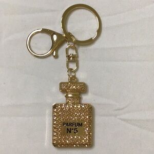 Gold Quilted Key Holder with Perfume Bottle Design